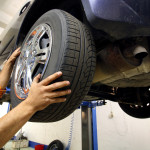 mechanic changing a car wheel.